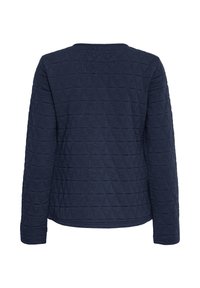 Veste matelassée bleu marine à manches longues et col rond, vue de dos sur un fond blanc.