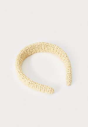 Beige woven headband made of textured material, circular design with smooth edges, suitable for securing hair.