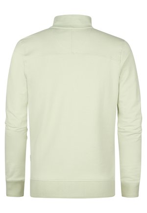 Felpa verde chiaro con colletto alto, maniche lunghe, polsini e orlo a costine. Realizzata in un materiale liscio e morbido con un design semplice.