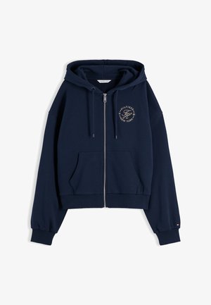Sweat à capuche zippé bleu marine avec cordons, poches avant, poignets et ourlet côtelés, et un petit logo circulaire sur la poitrine gauche.