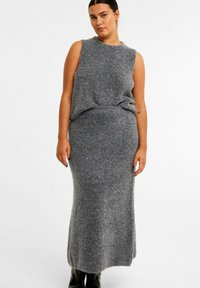 Gray knit two-piece set featuring a sleeveless top and long, fitted skirt. The fabric has a soft, textured finish, creating a cozy appearance.