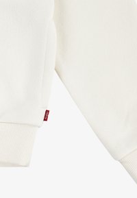 Levi's® LVG BATWING CHEST HIT - Jersey con capucha - egret