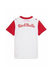 Červený dres s krátkym rukávom a bielym telom. Na chrbte je vyznačené "Red Bulls" tučným červeným písmom a červený golier. Textúrovaný materiál.