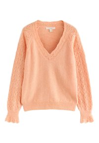 Brzoskwiniowy sweter z dekoltem w serek, teksturowanymi koronkowymi rękawami i dopasowanym dołem. Na rękawach misterny wzór liści. Miękki materiał.