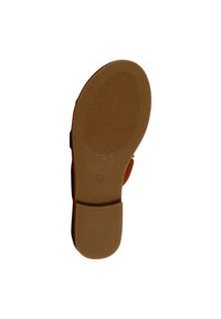 Suola di una scarpa marrone con una superficie liscia eTexturizzata, caratterizzata da un motivo circolare e un tacco rialzato. Taglia contrassegnata come 36.