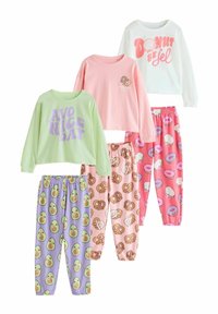 Five sets of children's pajamas featuring short and long-sleeve tops in pastel colors with fun prints of donuts, avocados, and pretzels.