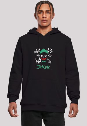Sort hætte sweatshirt med et farverigt Joker-grafik, der har grønt hår og rød mund, omgivet af "Hahaha" tekst i hvid. Blødt stof, pullover stil.