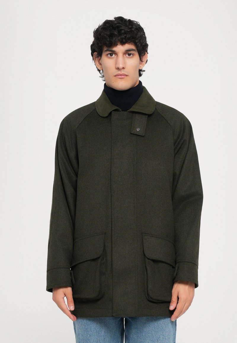 Green wool blend outerwear jacket with a button closure, raglan sleeves, and two front pockets. Textured fabric, collar in matching color.