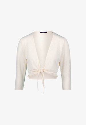 Cardigan court en crème claire avec des manches longues, un décolleté en V profond et un détail en nœud à l'avant. Fabriqué à partir d'un tissu doux et léger.