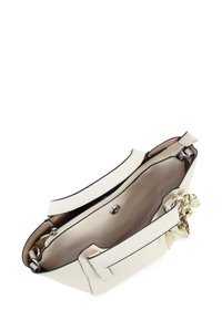 White leather handbag with a structured shape, contrasting black trim, and top handles. Interior features a light-colored lining and a zip pocket.