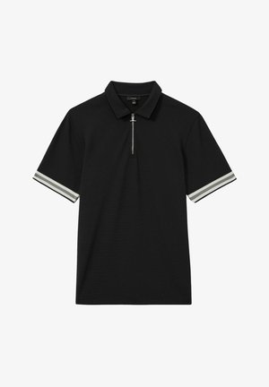Polo shirt noir à manches courtes, avec un col zippé et des accents rayés blancs sur les bords des manches. Fabriqué en tissu texturé.