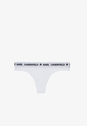 Białe stringi z czarnym elastycznym pasem, na którym znajdują się napisy i logo "KARL LAGERFELD". Materiał gładki i elastyczny.