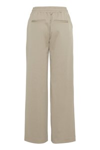 Beige bukser med vide ben, elastisk talje og to baglommer, vist bagfra på en hvid baggrund.