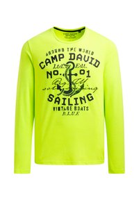 Langärmeliges T-Shirt in leuchtendem Neon-Gelb mit schwarzem grafischem Text und Anker-Design. Hergestellt aus weichem Stoff mit Rundhalsausschnitt.