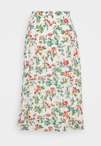 Jupe midi florale en tissu léger, avec un fond blanc et des fleurs colorées en rouge, bleu, jaune et vert.