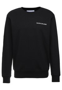 Black long-sleeve crewneck sweatshirt with "CALVIN KLEIN JEANS" text logo on the left chest.