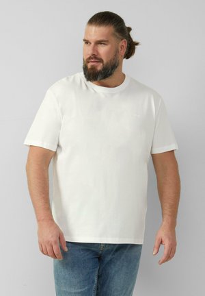 Witte katoenen t-shirt met korte mouwen, ronde hals en een ontspannen pasvorm. Minimalistisch ontwerp met een subtiele merklogo op de borst.