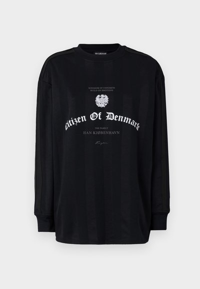 Black long-sleeve shirt with vertical stripes, featuring white text and graphics. Crew neck design with slightly dropped shoulders.