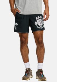 Black shorts with white graphic prints, including a lion and roses, featuring an elastic waistband and side pockets on each hip.