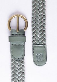 Woven green leather belt with a brass buckle and a smooth end piece featuring embossed floral detail. Stitched edges add durability.