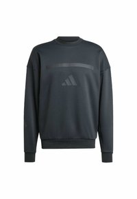 Sweat-shirt gris foncé, col rond, manches longues, avec des poignets côtelés et une texture lisse, présentant une bande horizontale brillante et un logo sur le devant.