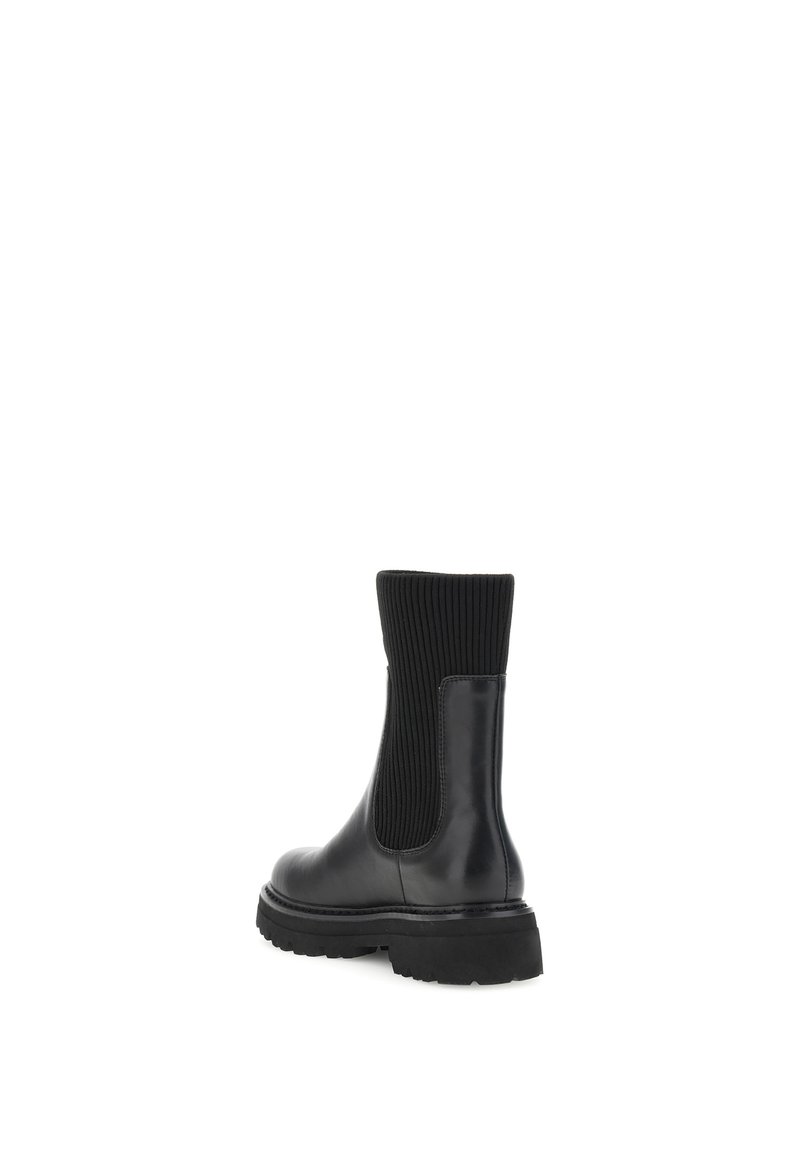 Schwarze Lederstiefelette mit einem ribbeligen Textil-Obermaterial, runder Zehenpartie, kräftiger Sohle und elastischem Einsatz am Schaftrand für ein einfaches An- und Ausziehen.