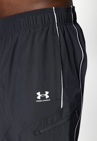 Under Armour CHALLENGER WARM UP  - Tracksuit bottoms - black/white