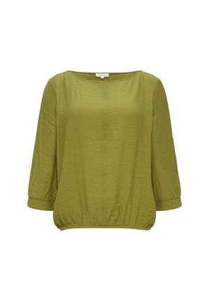 Blusa verde, morbida e ampia, realizzata in tessuto testurizzato con maniche 3/4 e orlo elastico. Collo tondo semplice, design minimale e senza fantasie.