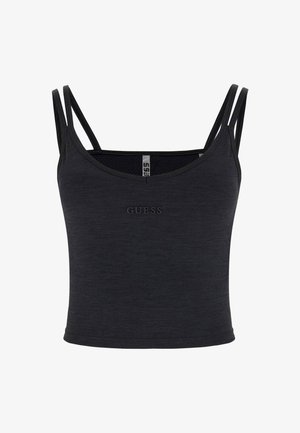 Svart figursydd linne med tunna dubbla axelband, tillverkat av ett mjukt, texturerat material. Har en tonad "GUESS"-logotyp framtill.