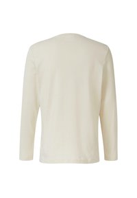 Crème lange mouwen t-shirt van zachte stof. Eenvoudige ronde halslijn en rechte zoom zonder zichtbare merktekens of patronen.