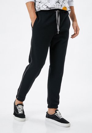 Pantalones deportivos - black