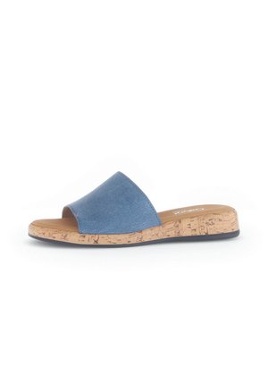 Slide sandal with a blue textured upper and cork midsole. Open design with a rounded toe, flat black rubber outsole.
