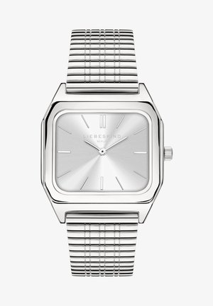 Sølv firkantet ur med en metallisk meshrem. Urskiven har minimalistiske timemarkører og en subtil radial tekstur. Mærke: Liebeskind Berlin.