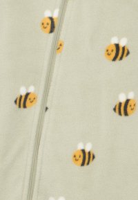 Φλις ζακέτα σε ανοιχτό πράσινο με ολοκληρωμένο σχέδιο μικρών κίτρινων και μαύρων μελισσών, με λευκά φτερά και χαμογελαστά πρόσωπα.