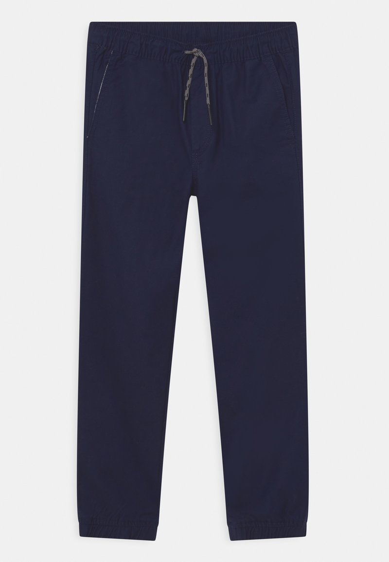 Pantalon décontracté bleu marine avec taille élastique, cordon gris, poches latérales et poignets élastiques aux chevilles sur fond blanc.