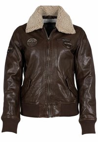 Bruine leren bomberjack met een beige schapenvachtkraag, voorzien van geborduurde patches, ritssluiting en geribbelde manchetten en zoom.
