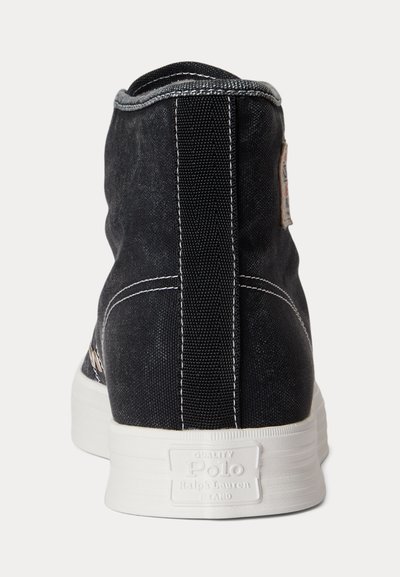 Black high-top canvas sneaker with white stitching and thick white sole, Polo Ralph Lauren logo embossed on heel tab.