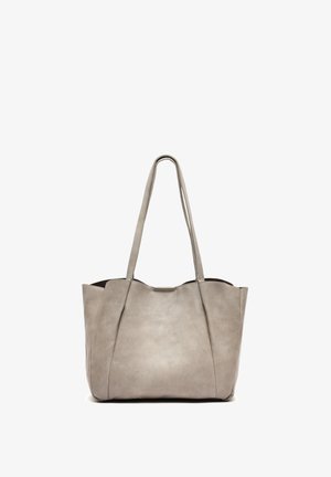 Gray leather tote bag with two long handles, a smooth texture, and a slightly structured shape. Notable for its minimalist design.