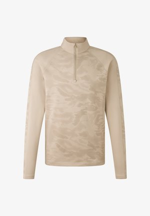 Beige long-sleeve top with a half-zip collar, featuring a textured camouflage pattern and raglan sleeves for enhanced movement.