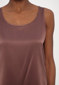 Brown satin tank top with a round neckline and thin straps, smooth texture, flowing design without patterns or accents.