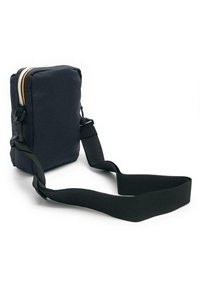 Dark navy fabric bag with a rectangular shape, featuring a contrasting zipper and adjustable black strap. Soft texture and compact design.