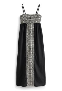 Schwarzes Maxikleid mit verstellbaren Spaghetti-Trägern, das einen gemusterten Oberteil und von Tribal inspirierten weißen Stickereien entlang der Mitte zeigt.