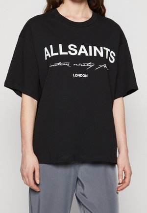 Black oversized t-shirt with a white graphic print reading "ALLSAINTS" and "LONDON," featuring short sleeves and a relaxed fit.