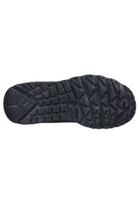 Suola in gomma nera con un motivo di grip testurizzato, caratterizzata da profonde scanalature e forme triangolari per aderenza e durata.