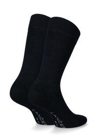 Czarne skarpetki bawełniane z prążkowanym ściągaczem i gładką fakturą. Z białym logo na podeszwie, w klasycznym fasonie do kostki.
