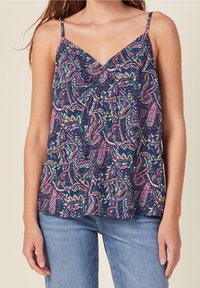 Navy blue sleeveless top featuring a vibrant paisley pattern in pink, green, and white with a V-neckline and thin straps, made of lightweight fabric.