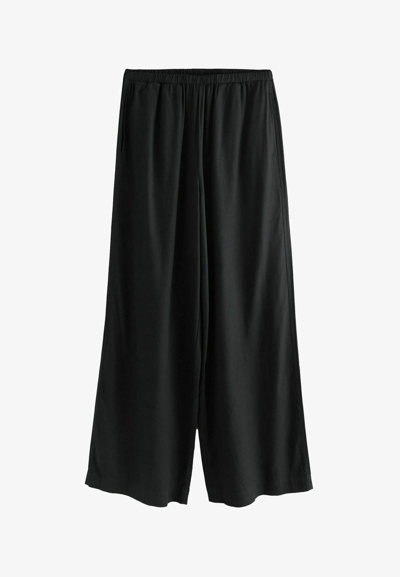 Czarne spodnie w luźnym kroju wykonane z miękkiego materiału z elastycznym pasem. Charakteryzują się swobodnym fasonem i prostym cięciem, idealne do codziennego noszenia.