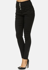 Hoch taillierte schwarze Jeans im Skinny-Style aus Denim mit einer Fünfknopf-Verschluss, zwei vorderen Taschen und einer glatten Textur. Verfügt über einen maßgeschneiderten Schnitt und ein schlankes Design.