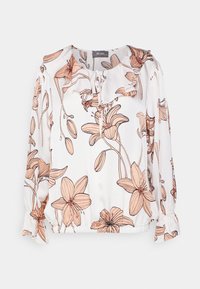Blusa floreale con sfondo bianco, caratterizzata da fiori color pesca, collo con volant e polsini elasticizzati. Tessuto leggero e intrecciato.