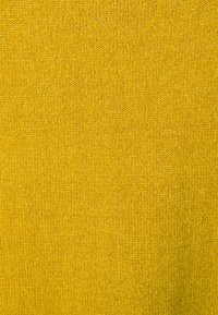 Stickad tyg i en livlig gul färg, med en texturerad mönster och en fin, jämn väv. Lämplig för klädesplagg eller accessoarer.